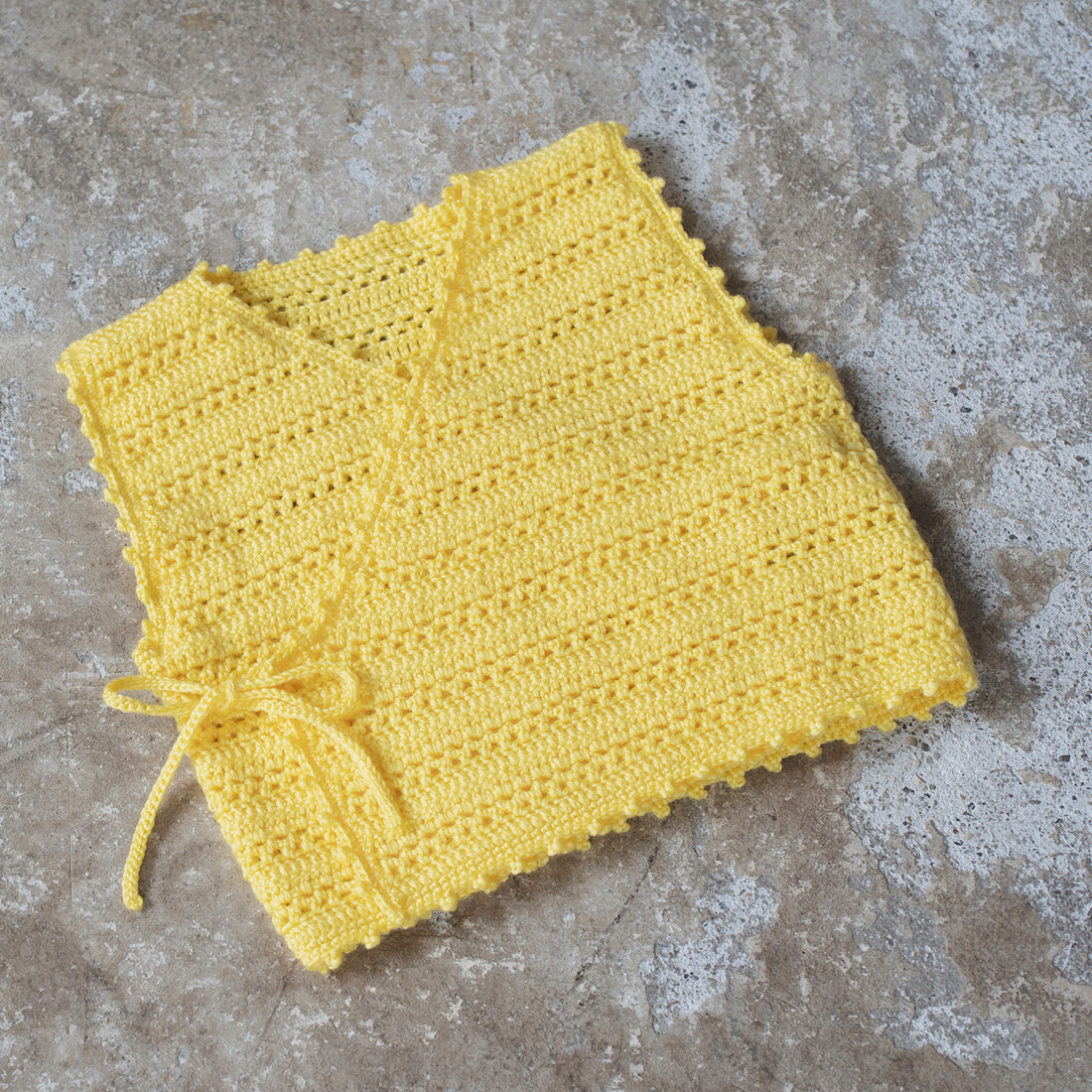 Knitting pattern for openwork border vest (12-24 months)